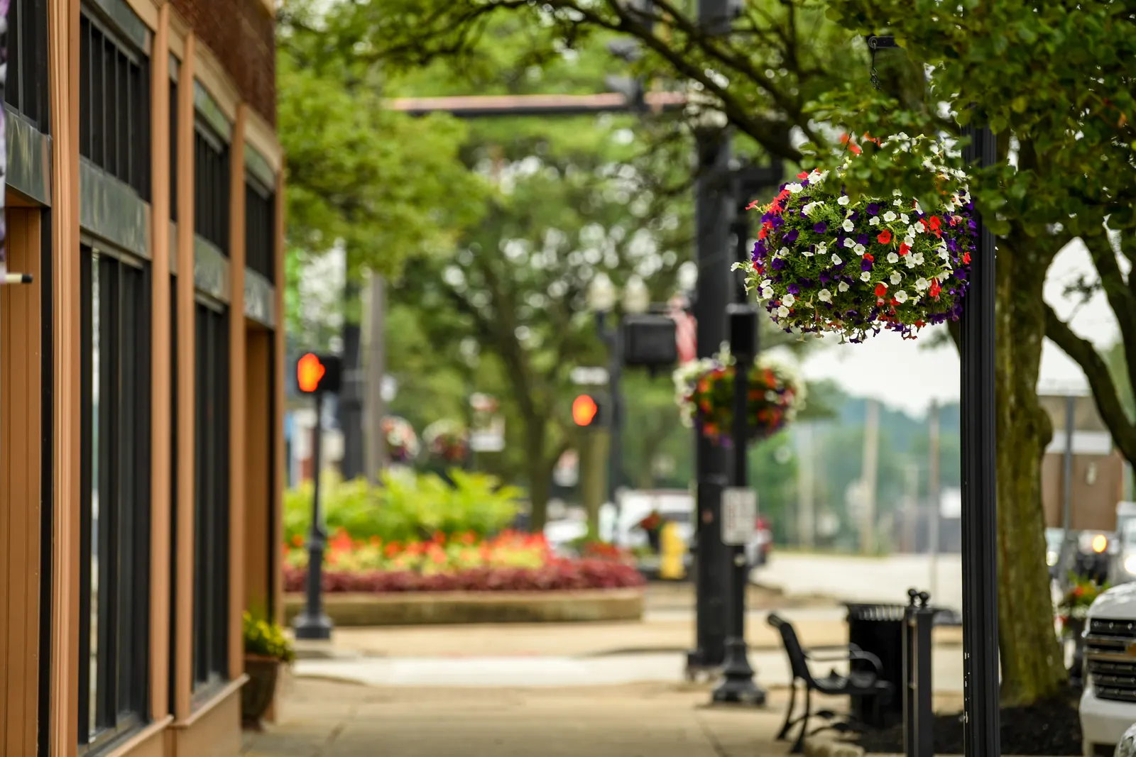 Hanging flower baskets along a downtown Wadsworth sidewalk in summer